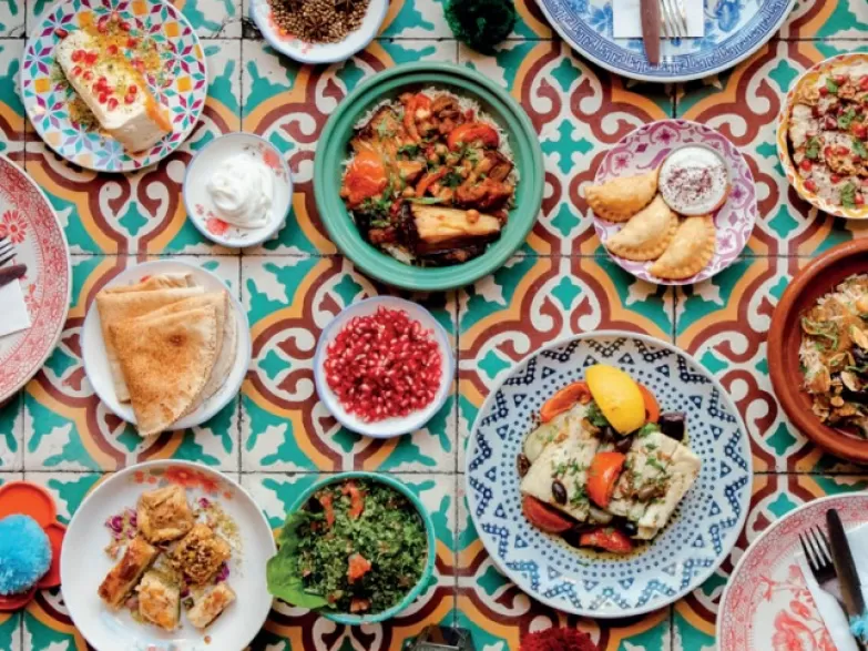 Image showing range of dishes on colourful table top